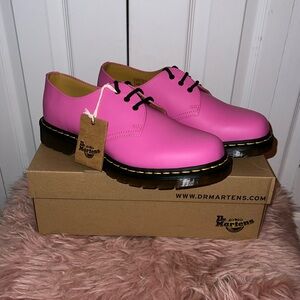 Pink Dr. Martens. Brand New w/tags in box. Women’s 10/ Men’s 9 US. Unisex.
